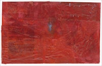 a red piece of paper with a piece of paper on it